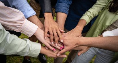 Multicultural young people joining hands in stack - unity and collaboration concept, Photos - Envato Elements